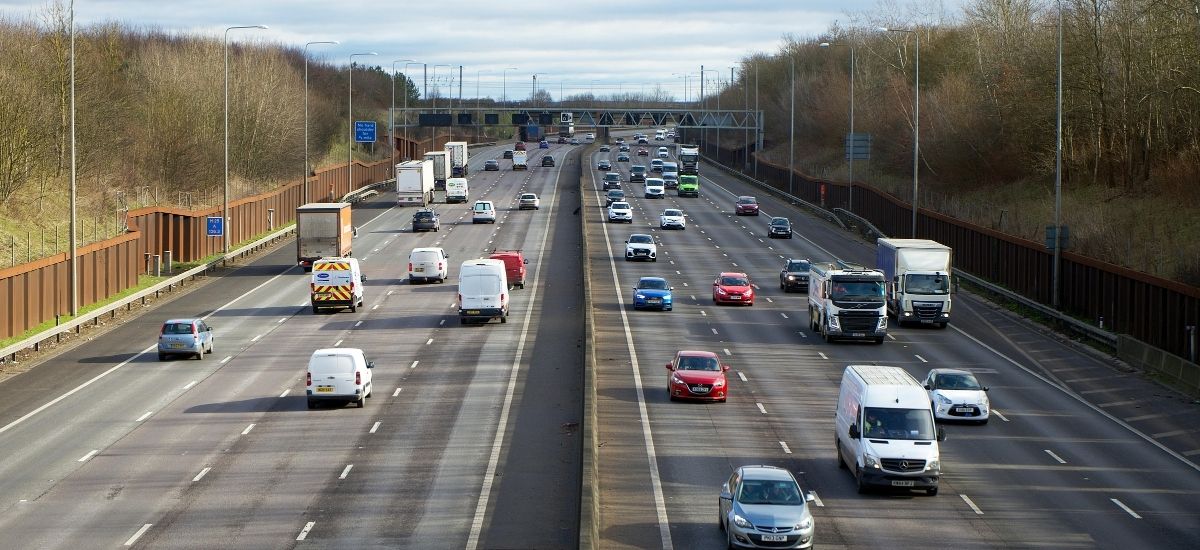 qrun-uk-motorway-nationwide Aerial view of a UK motorway interchange showing nationwide private hire reach from Bristol